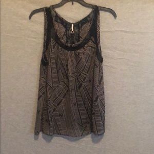 Sleeveless, sheer blouse